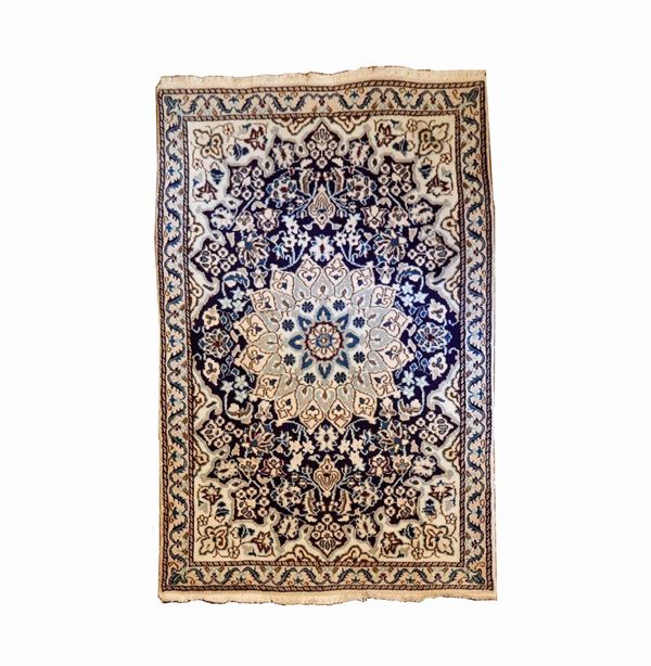 Persian carpet with geometric-floral design on a havana and blue background, M. 1.35 x 0.86