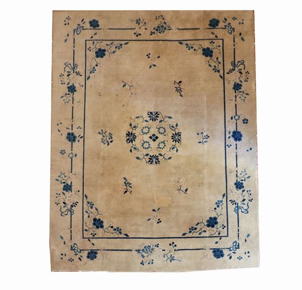 Chinese carpet with havana background with double stylized border and central rosette with blue flowers, defects and rapè, m 3.50 x 2.77