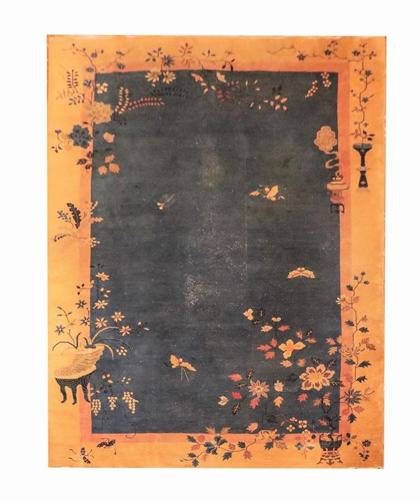 Chinese carpet with blue background and havana border, with decorations of flowers and butterflies, very rapè, M. 5.26 x 3.33