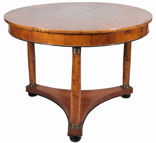 Empire line round extendable dining table in walnut
