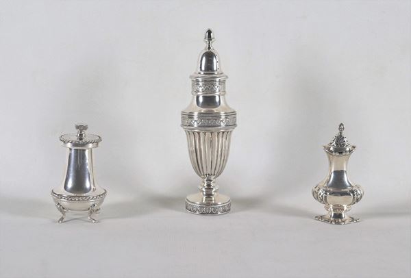 Chiseled and embossed silver lot of a sugar spreader, a pepper pot and a pepper mill, (3 pcs) gr. 210