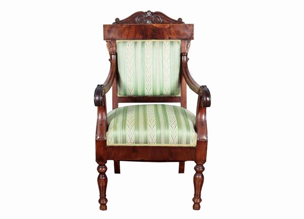 Antique Tuscan Empire armchair, in mahogany and mahogany feather, with curved armrests and rectangular backrest surmounted by carved molding