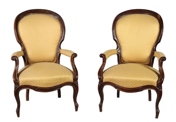 Pair of Louis Philippe armchairs in mahogany, with "trunk" backs and armrests and curved legs