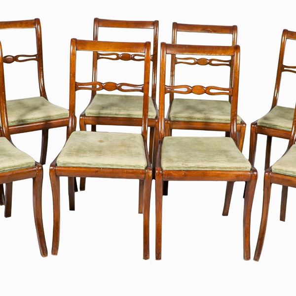 Lot of eight Tuscan chairs in mahogany, with openwork backs and saber legs, cover in light green velvet