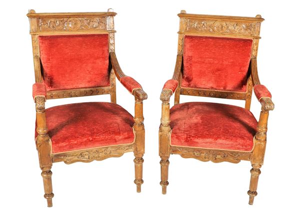 Pair of walnut armchairs from the Renaissance line, with carved backs and armrests, covering in antique pink velvet