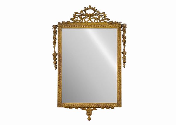 Antique mirror of the Louis XVI line, in gilded wood and carved with intertwined cords and flower cords, on the noble crown cimasa. Mercury mirror