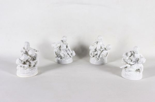 Lotto di quattro gruppi "Putti festanti" in porcellana bianca di Capodimonte