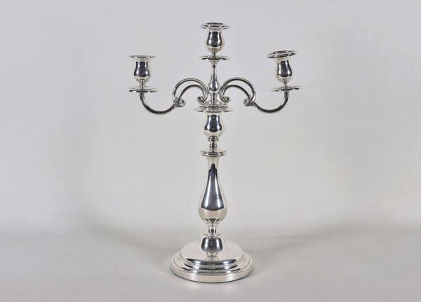 Candelabra in silvered metal, embossed and chiseled with 3 flames