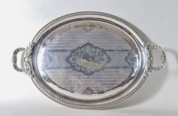 Antique large oval tray in embossed and chiseled silver-plated metal