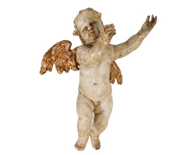 "Putto alato", piccola scultura in legno laccato avorio e dorato