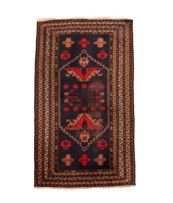 Persian carpet with a blue and red background, with geometric designs and brown borders, M. 1.85 x 0.98.