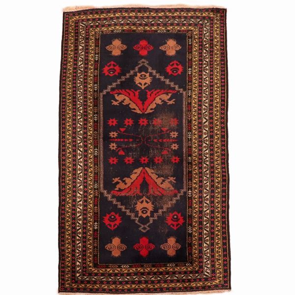 Persian carpet with a blue and red background, with geometric designs and brown borders, M. 1.85 x 0.98.