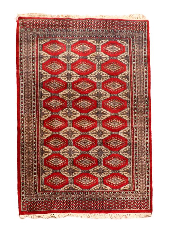 Shirvan carpet with geometric designs on a red background, M. 1.85 x 1.25.