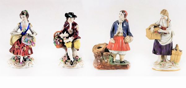 Lot of two pairs of polychrome porcelain figurines "Peasants"