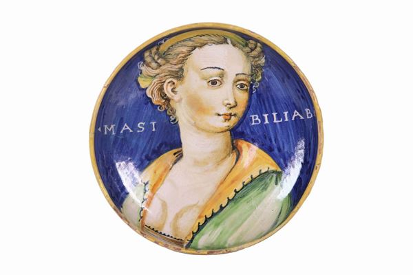 Crespina in glazed majolica from Casteldurante, with the painting "Portrait of a young woman" in the center