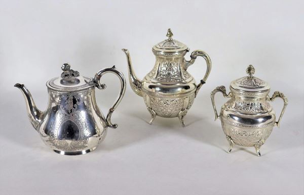 Embossed and chiseled silver metal lot of a teapot, a coffee pot and a sugar bowl (3 pcs)