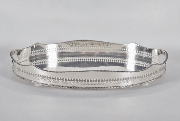 Oval tray in embossed and chiselled silver metal with perforated railing