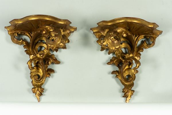 Pair of wall shelves in gilded wood