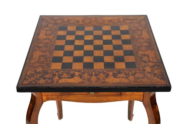 Square center table in walnut, with top entirely inlaid in boxwood with motifs of deer, amphorae and floral intertwining and checkerboard in the center. One pull and four curved legs