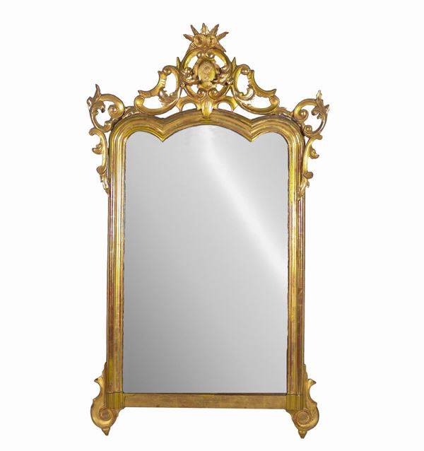 Antique Neapolitan Louis Philippe mirror in gilded wood carved with motifs of acanthus leaves and curls, engraved momogram on the molding
