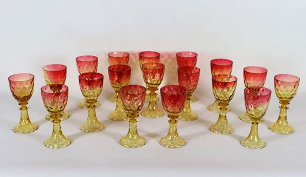 Lot of eighteen goblet glasses in amber and ox blood worked crystal