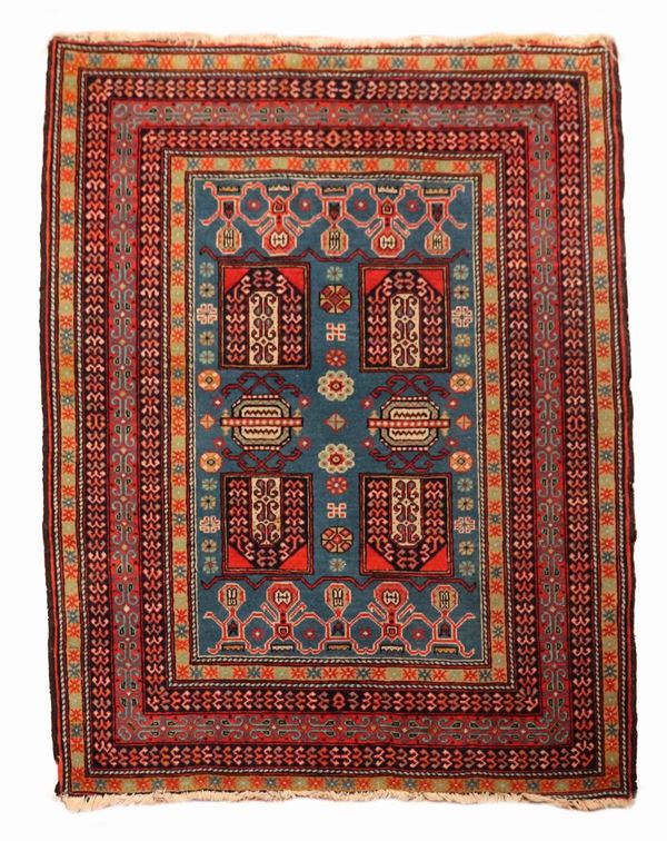 Persian Kurdistan carpet with blue background with red border, 1.43 x 1.06 m
