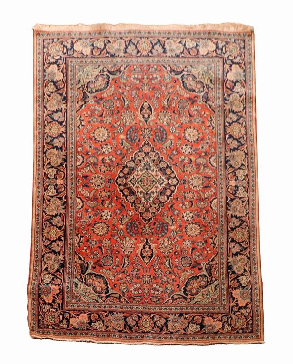 Persian Kashan carpet with red background and blue border, M. 1.98 x 1.35