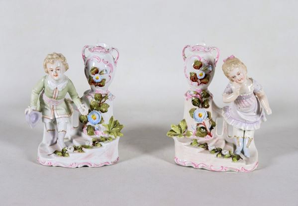Pair of small French groups in polychrome porcelain "Children with vases and flowers"