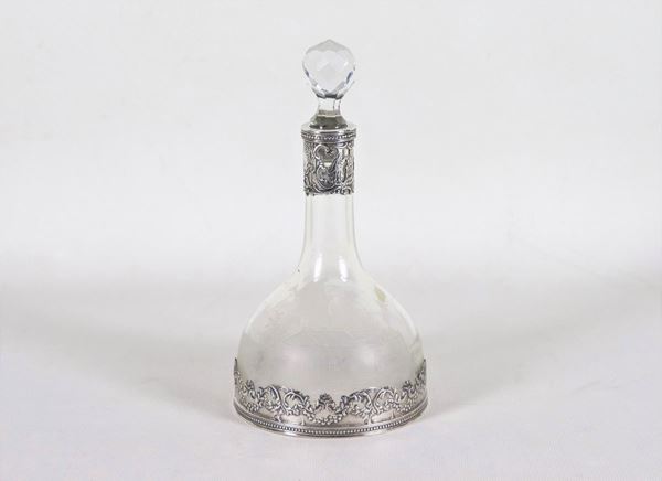 Antique small bottle in engraved crystal, with base and neck in chiseled and embossed silver