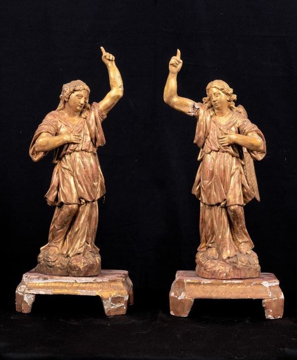 Pair of ancient sculptures "Angels", in gilded and carved wood