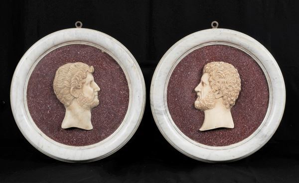 "Teste di Imperatori Romani", coppia di medaglioni in marmo bianco e marmo di porfido