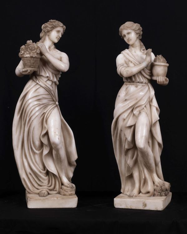 "Vestals with flower baskets", pair of white marble sculptures