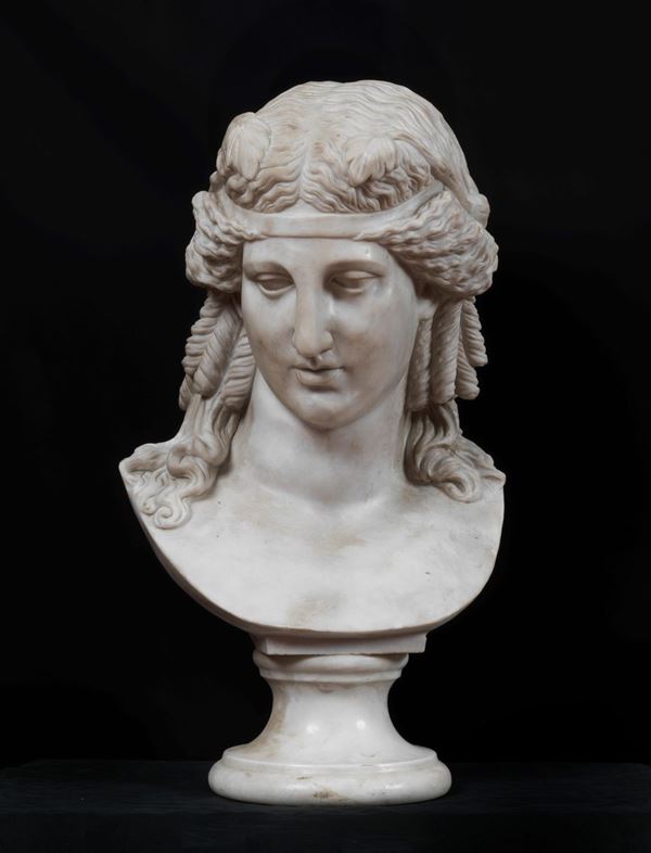 "Narciso", white marble bust supported by a round base