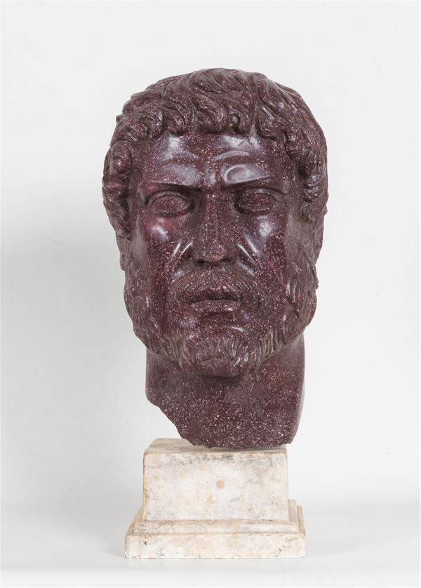 "Head of Ancient Roman", porphyry marble sculpture supported by a quadrangular base in white marble. The face has been restored