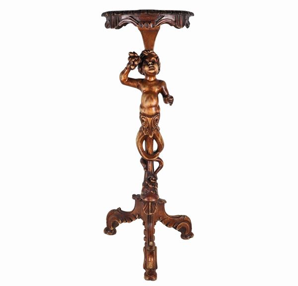 Venetian perch in fruit wood with sculpture of "Putto with a bunch of fruit", supported by three curved legs