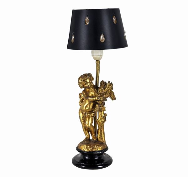 "Putto with cornucopia", small sculpture in gilded metal, transformed into a lamp