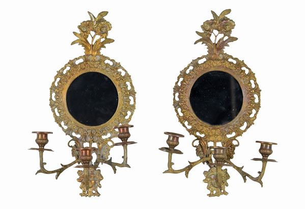 Pair of French appliques in gilt bronze, embossed and chiseled with Empire motifs, with round mirrors and 3 flames each