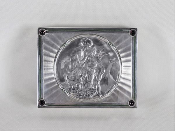 Antique French box covered in chiseled and embossed silver, on the lid medallion with "Venus and Amorino", enamel and semiprecious stone trimmings