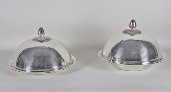 Pair of round silver plated and embossed metal lunchboxes, slightly different sizes