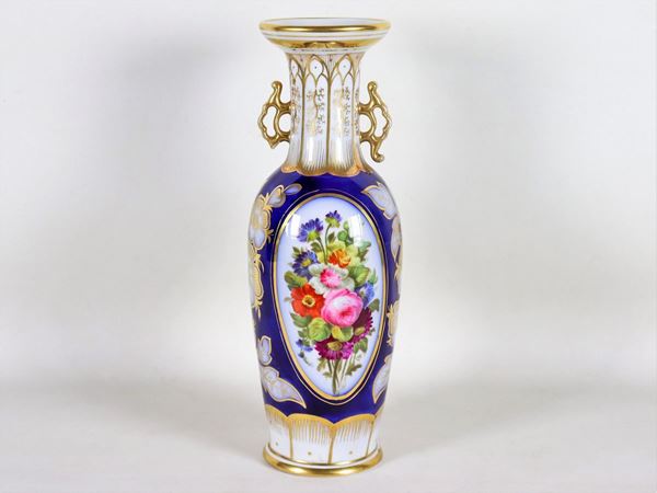 Louis Philippe vase in blue, white and gold porcelain, with colorful decorations in scrolls and bunches of flowers