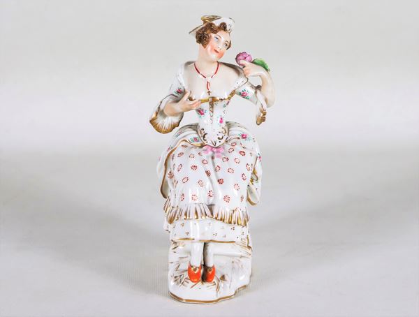 Piccola scultura in porcellana policroma "Giovane dama con rosa", firmata Jacob Petit