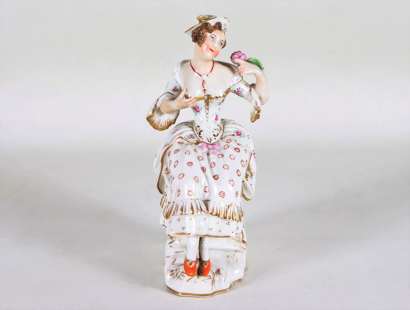 Piccola scultura in porcellana policroma "Giovane dama con rosa", firmata Jacob Petit