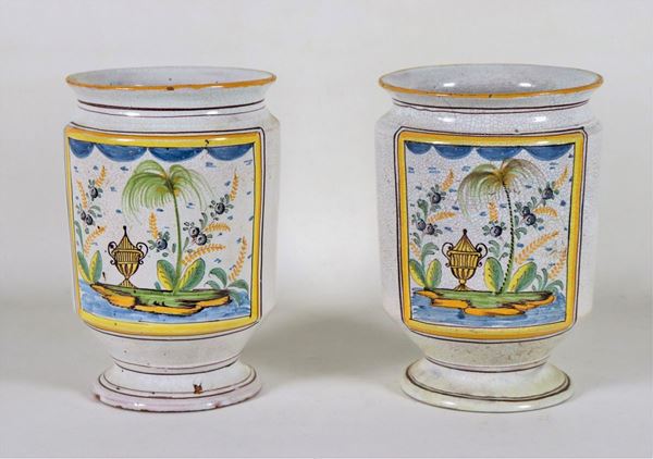 Pair of majolica albarelli with colorful decorations with amphorae and palm motifs