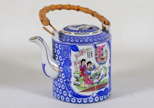 Blue porcelain teapot, with colorful decorations of oriental life scenes, handle covered in bamboo