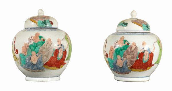 Pair of large potiches with porcelain lids, decorated with polychrome enamels in relief with figures of "Peasants and monks"