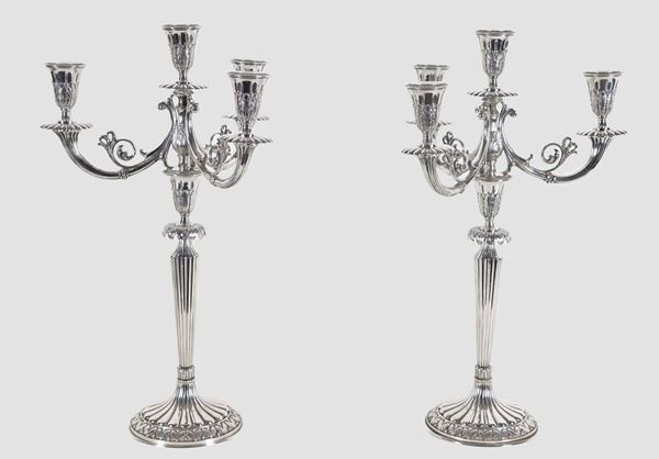 Pair of chiseled and embossed silver candelabra with Louis XVI motifs, 4 flames each, gr. 2360