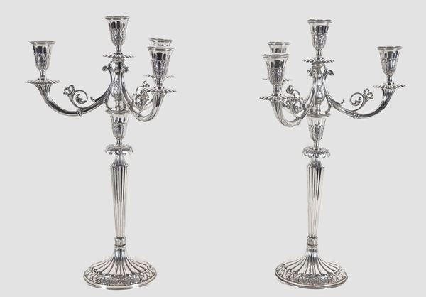 Pair of chiseled and embossed silver candelabra with Louis XVI motifs, 4 flames each, gr. 2360