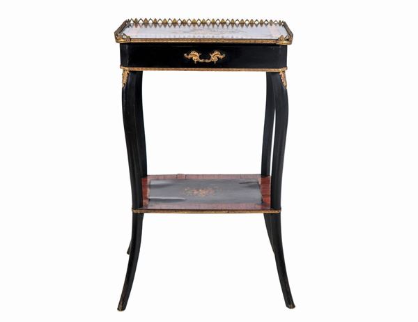 French gueridon from the center with rectangular shape in ebonized wood and walnut, with inlays with motifs of bunches of flowers, a central puller, four curved legs and perforated railing on the top