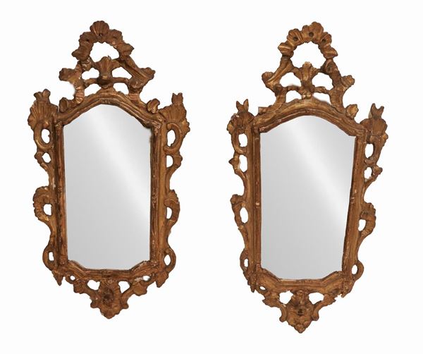 Lot of two small mirrors called "Ventoline" in gilded wood and carved with Louis XV motifs, mercury mirror