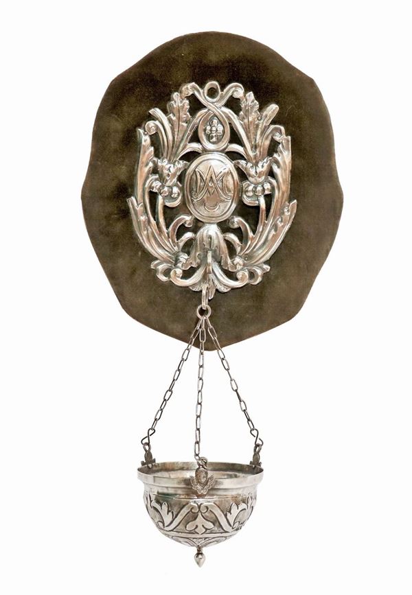 Roman holy water stoup in chiseled and embossed silver, mounted on a green velvet support